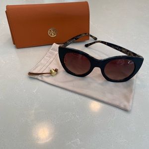 Tory Burch sunglasses with orange case and dust bag.